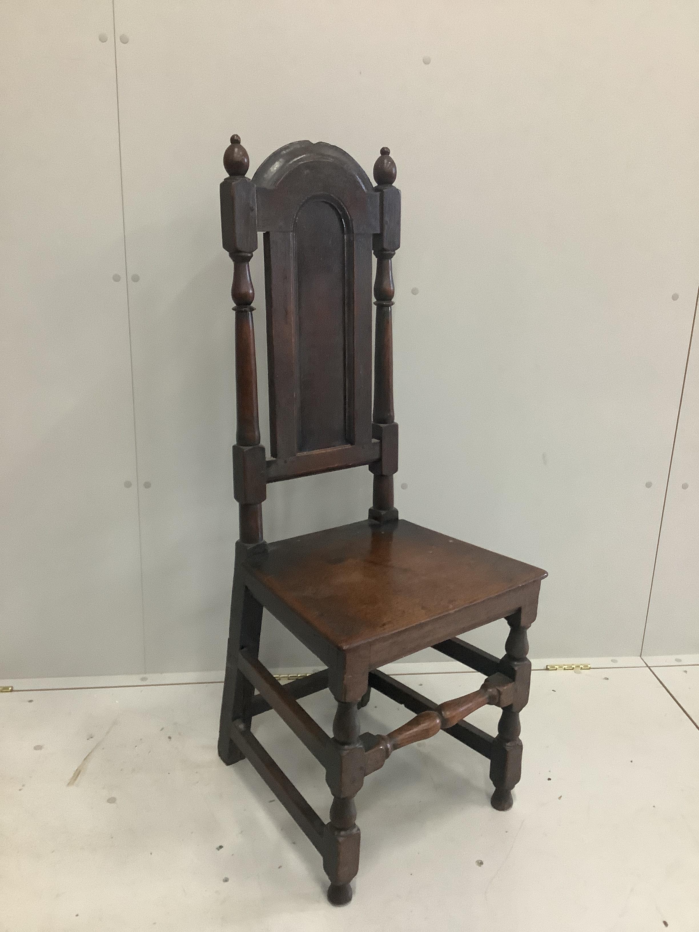 A late 17th century oak panel back chair